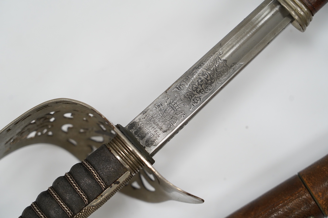 An 1895 pattern infantry officer’s sword by Wilkinson, proof number 34431, blade 82cm, in it’s leather field service scabbard with hangers and sword knot, with supporting research confirming that it was purchased by the